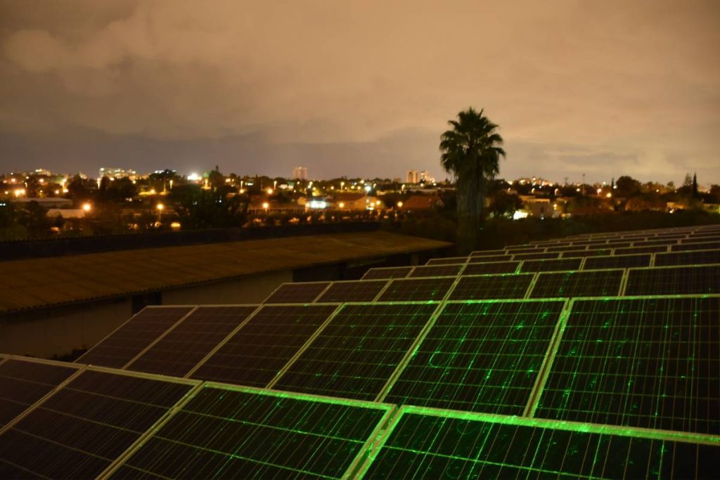 solar panel system in city at night