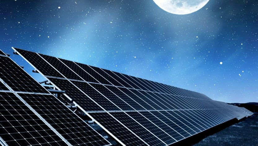solar panels at night with moon